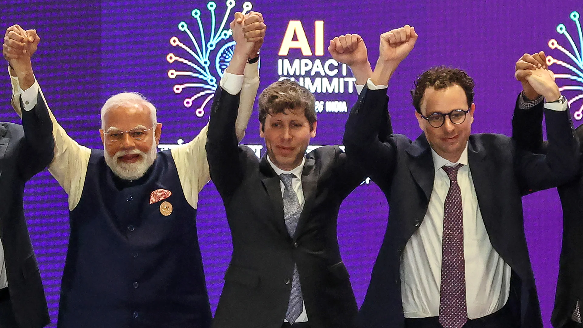 Sam Altman and Dario Amodei Refused to Hold Hands on Stage—and the Internet Is Losing It