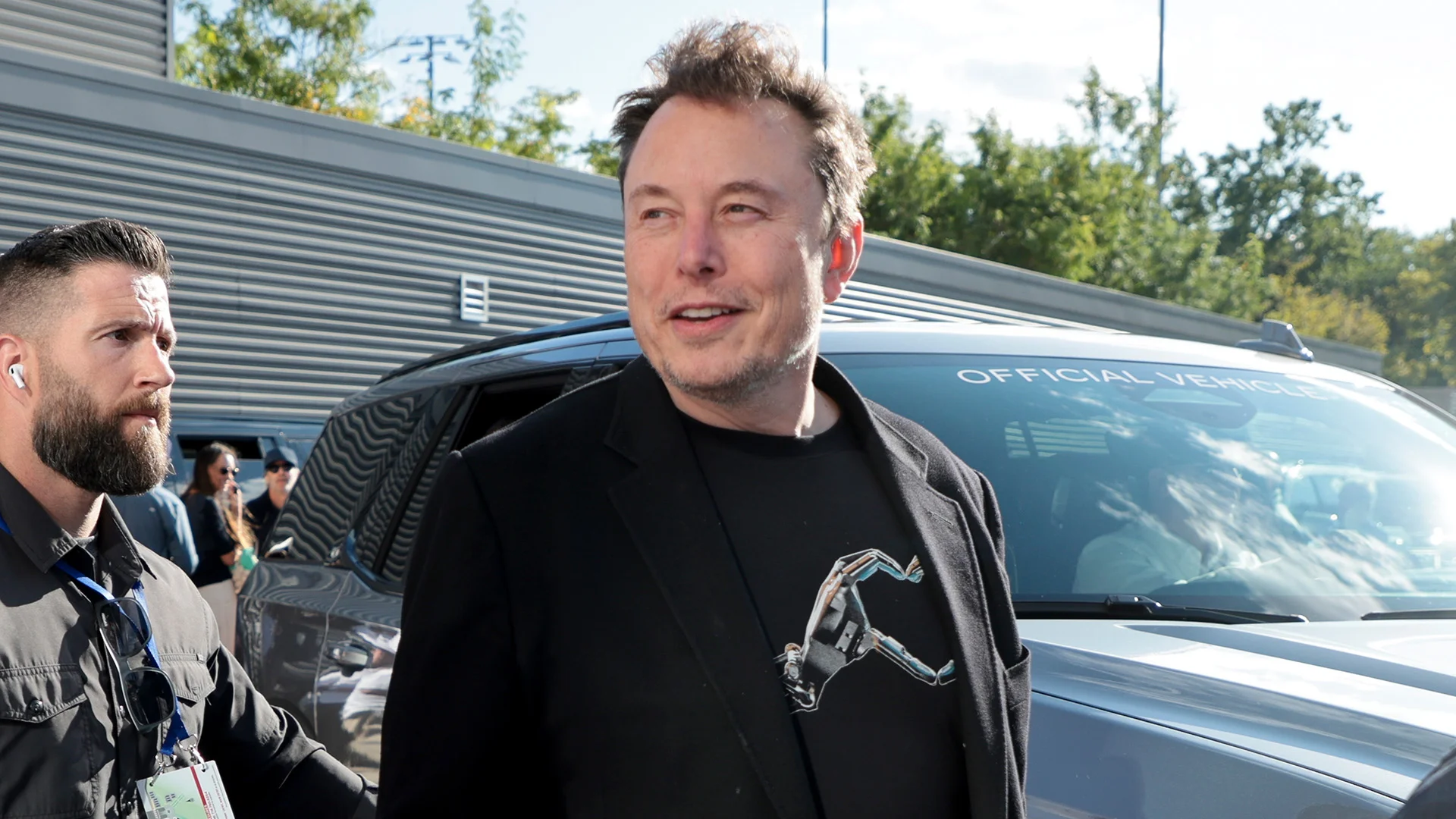 Elon Musk speaking at a tech conference