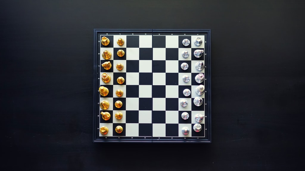 Male chess player with figures in the eyes, thinking process