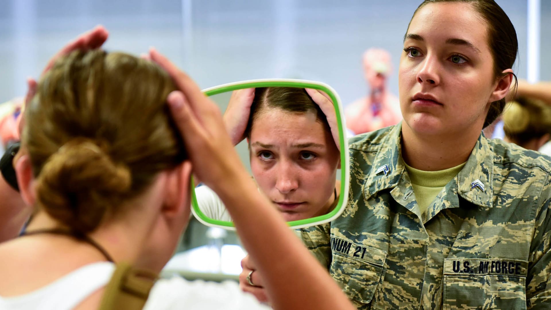 A new cadet experiences her first day at the U.S. Air Force Academy in Colorado Springs, Colo., June 27, 2019. Upon arrival, new male cadets receive haircuts, while female cadets learn to style their hair within academy standards.