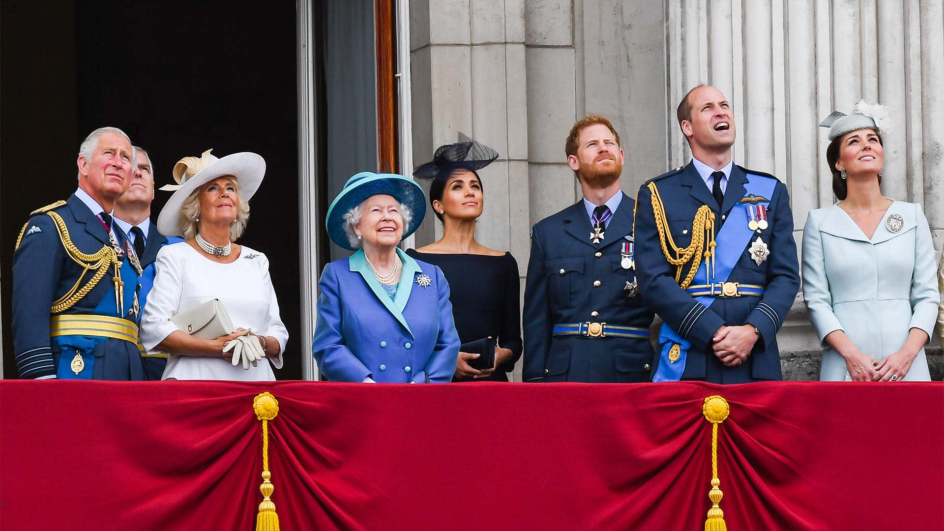 Members of the British royal family stand on the balcony of Buckingham Palace in London to view a flypast to mark the centenary of the Royal Air Force. 