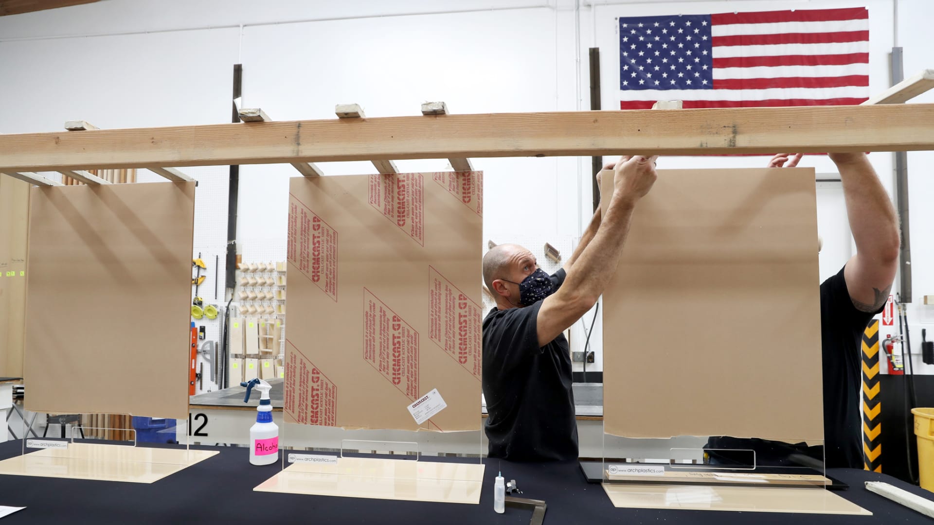 Architectural Plastics assembles acrylic sheets that will be used for social-distancing guards for businesses on May 7, 2020 in Petaluma, California.