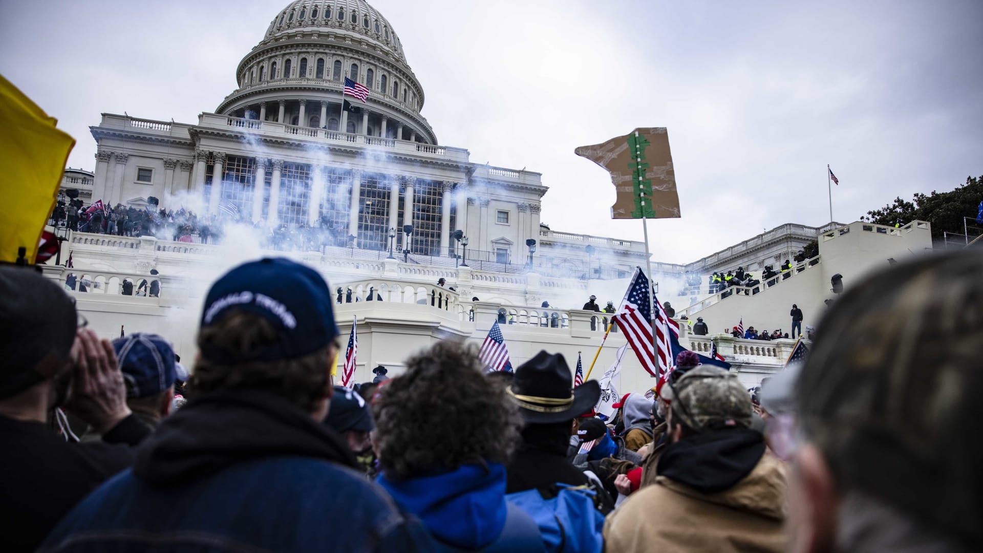 A mob enraged by the ratification of President-elect Joe Biden's Electoral College victory over President Trump in the 2020 election storms the U.S. Capitol following a rally led by Trump on January 6, 2021. 