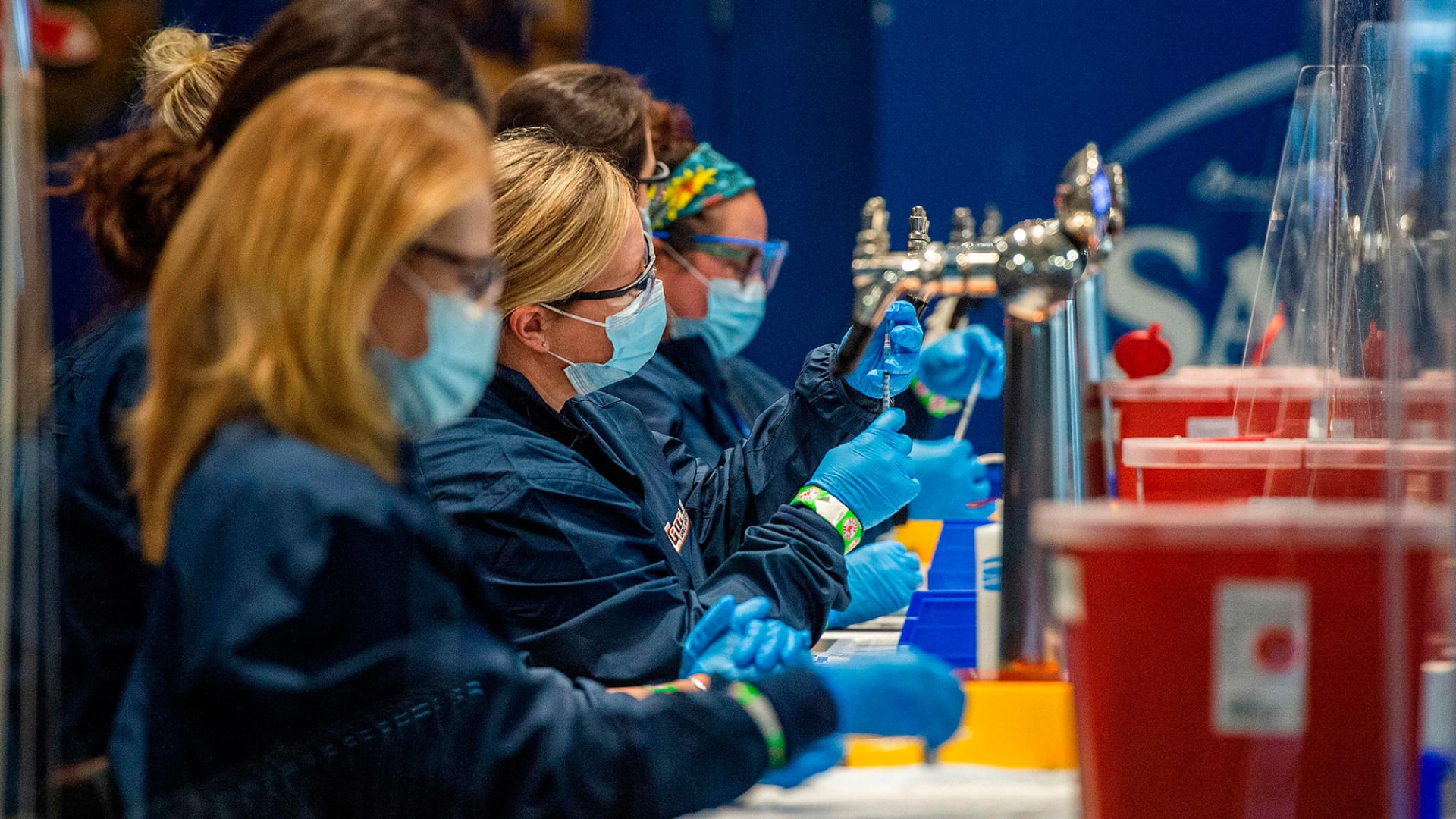 Medical staff workers prepare syringes with doses of the Covid-19 vaccine at Fenway Park in Boston in January.