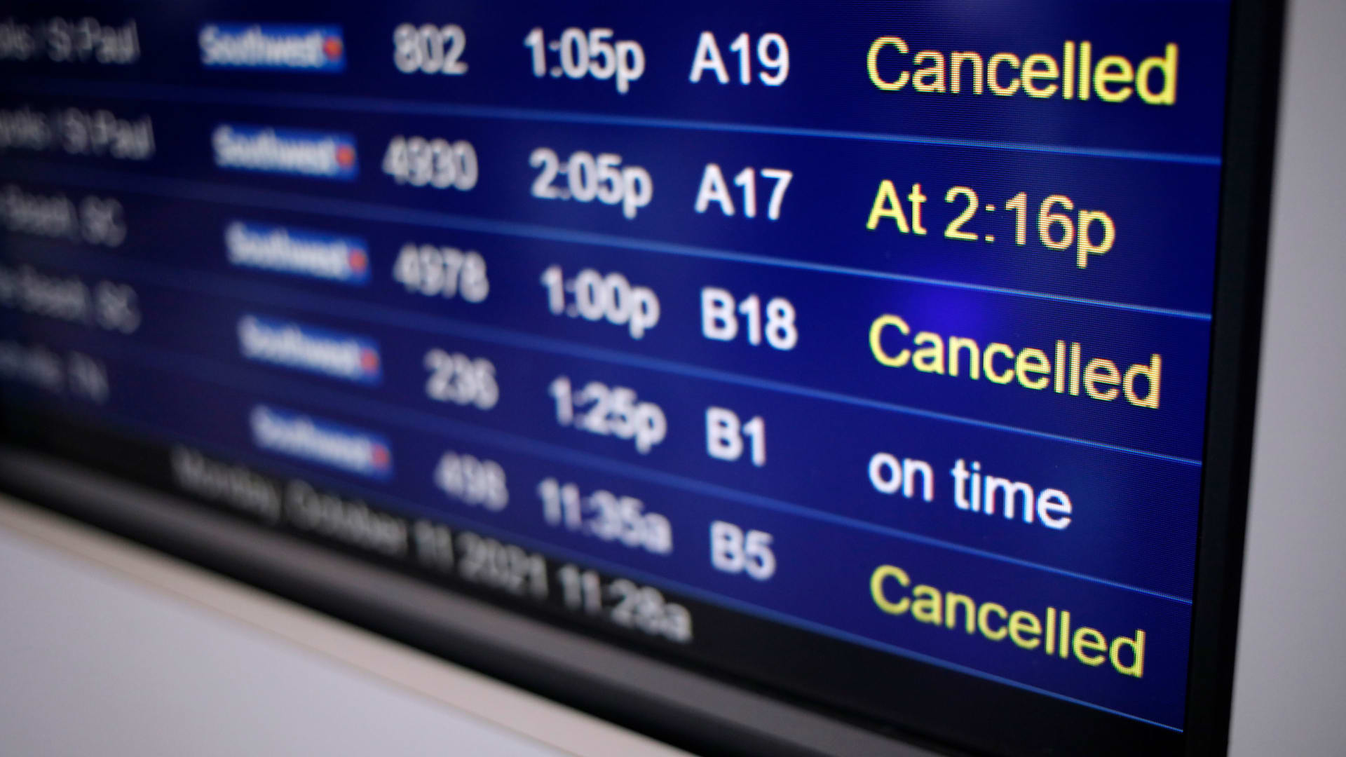 Cancelled Southwest Airlines Co. flights are marked on a departures board at Midway International Airport.