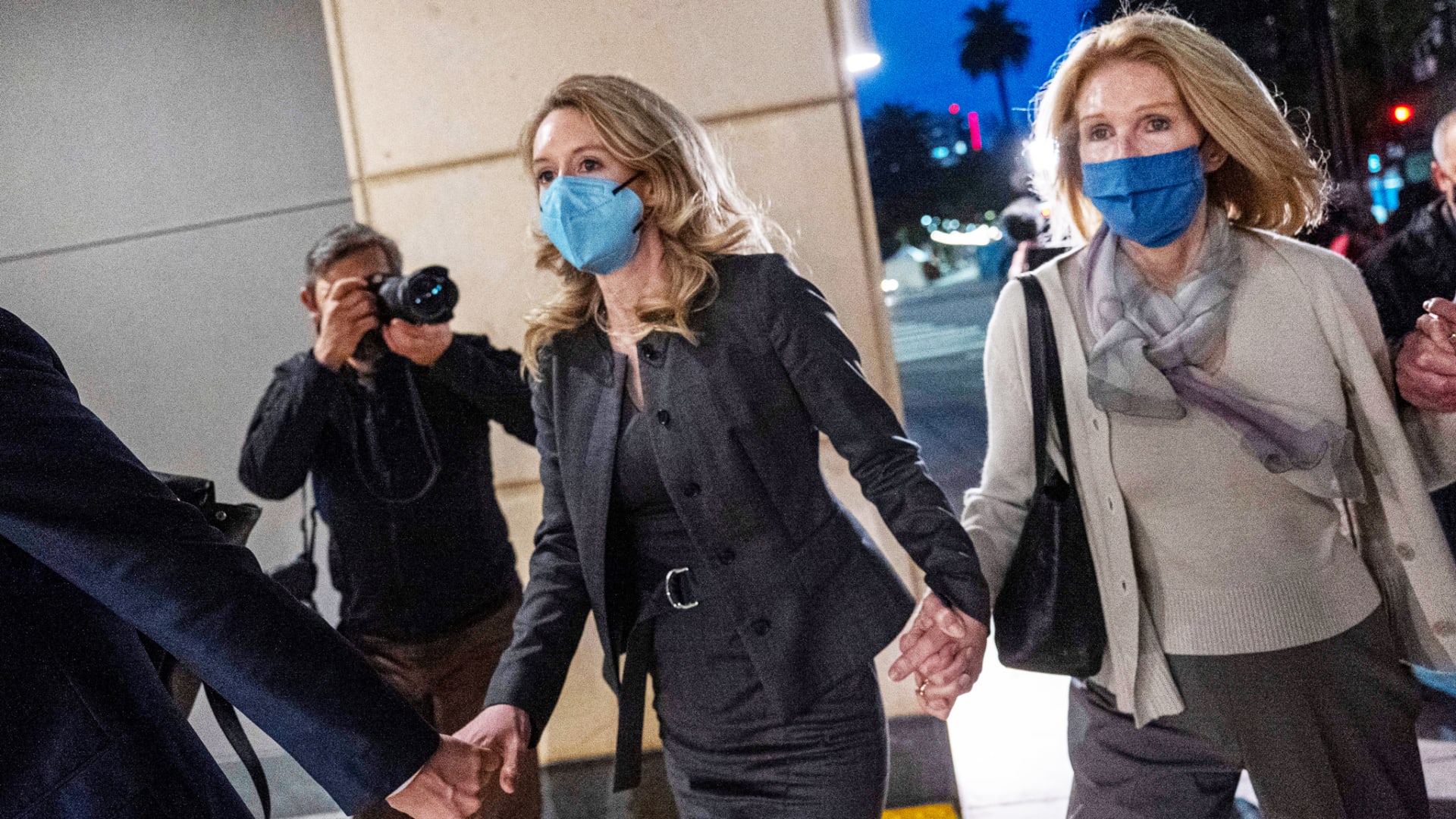 Theranos founder Elizabeth Holmes (left) departs from federal court with her mother, Noel Holmes, in San Jose, California.