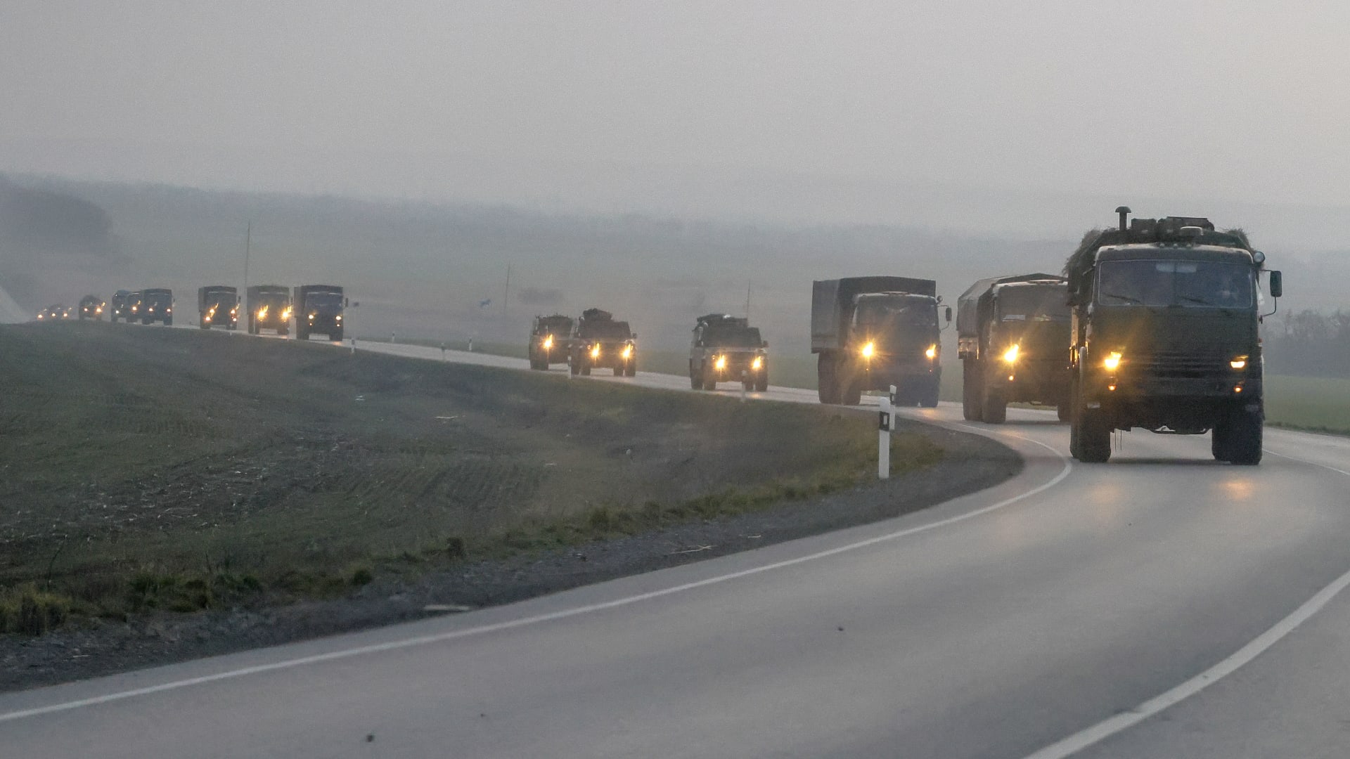 A convoy of Russian military vehicles move towards the border in the Donbas region of eastern Ukraine on February 23, 2022.