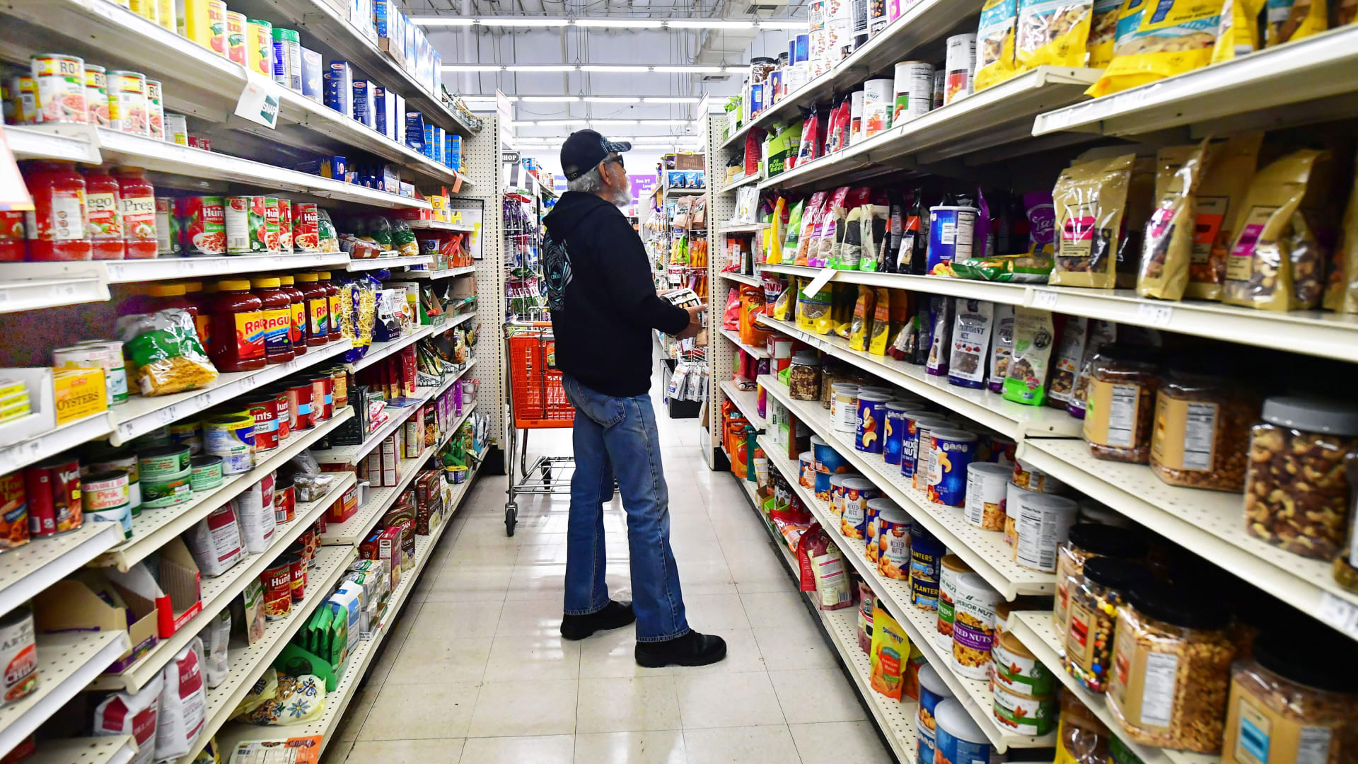 A shopper pauses in the aisle while shopping for food items in Alhambra, California