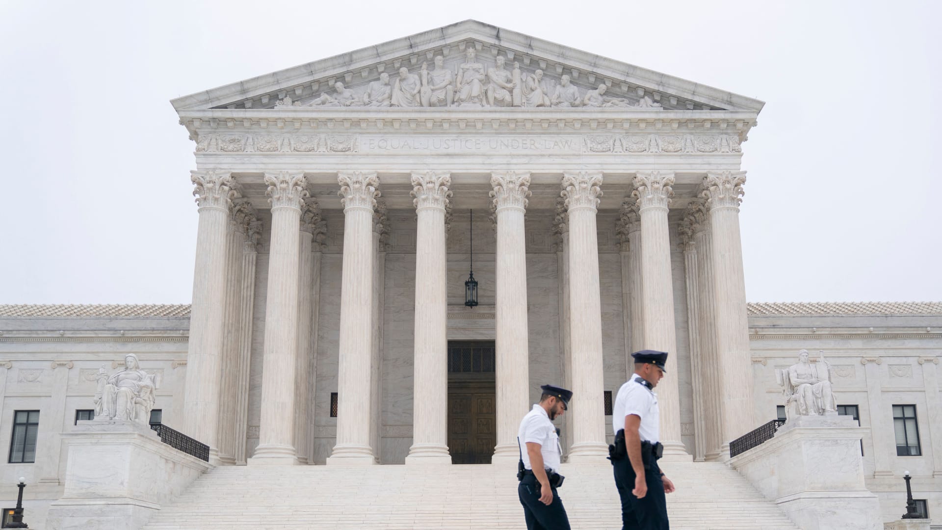 Police officers walk in front of the U.S. Supreme Court in Washington, D.C., on May 3, 2022.