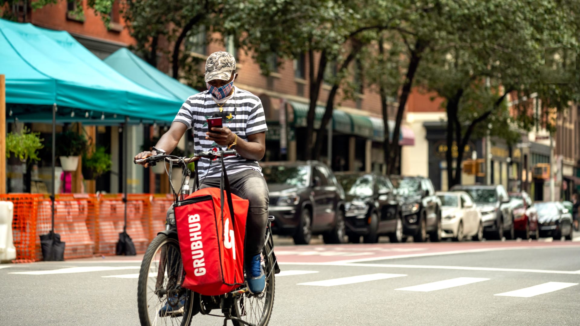 A Grubhub food delivery person rides on Manhattan's Upper East Side.