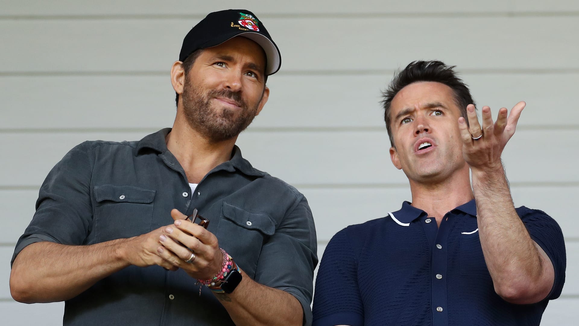 Ryan Reynolds and Rob McElhenney, co-owners of Wrexham, react prior to the Vanarama National League Play-Off Semi Final match between Wrexham and Grimsby Town.