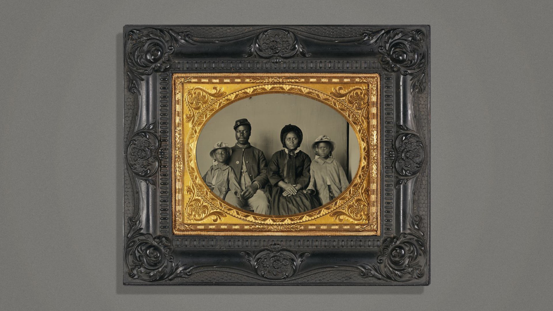An unidentified Union soldier and his family sometime between May 1863, when the Bureau of U. S. Colored Troops was established, and 1865. Maryland, where this photo was found, raised seven U.S. Colored Troop regiments..