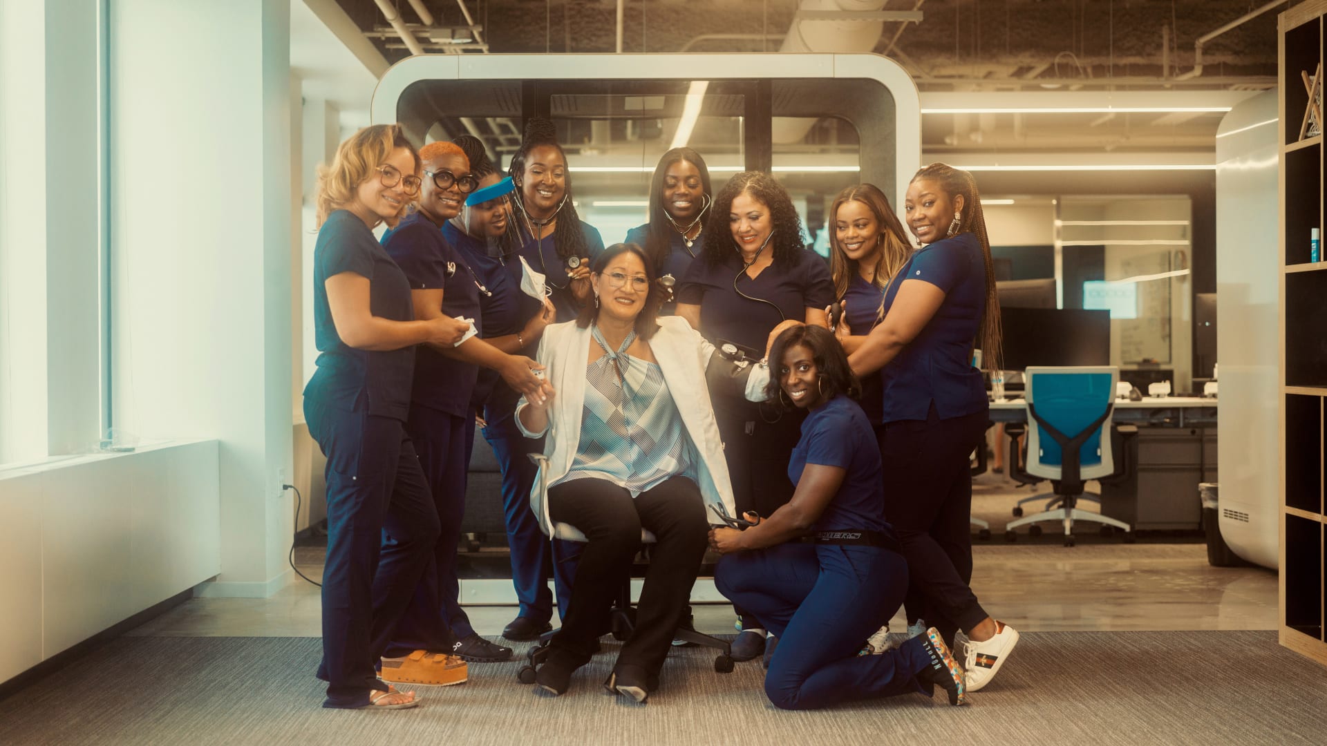 Founder and CEO of SnapNurse Cherie Kloss (center), surrounded by SnapNurse's nurses.